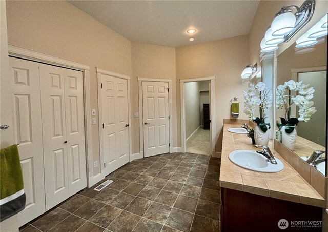 50 Holbrook Ln, Aberdeen, WA 98520 - full bathroom with a sink, a closet, visible vents, and double vanity
