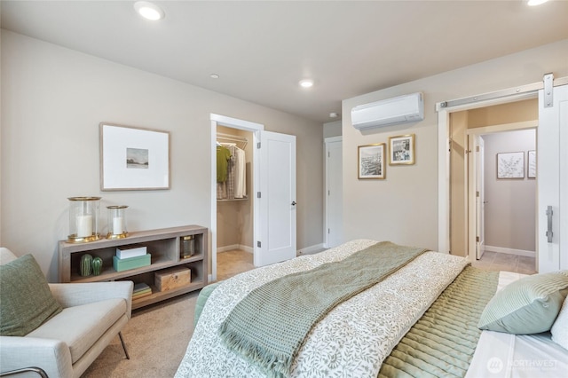 bedroom with baseboards, recessed lighting, an AC wall unit, and a barn door