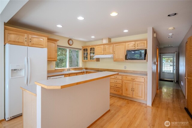 19002 20th St NW, Lakebay, WA 98349 - kitchen featuring white fridge with ice dispenser, black microwave, under cabinet range hood, light brown cabinets, and recessed lighting