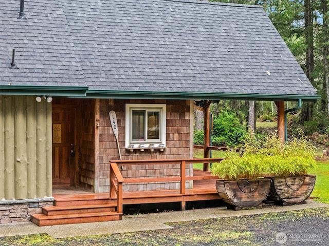 wooden deck with an outbuilding