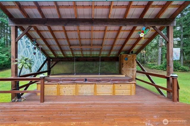 wooden terrace with a covered hot tub