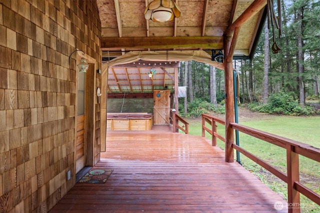 wooden deck featuring a yard