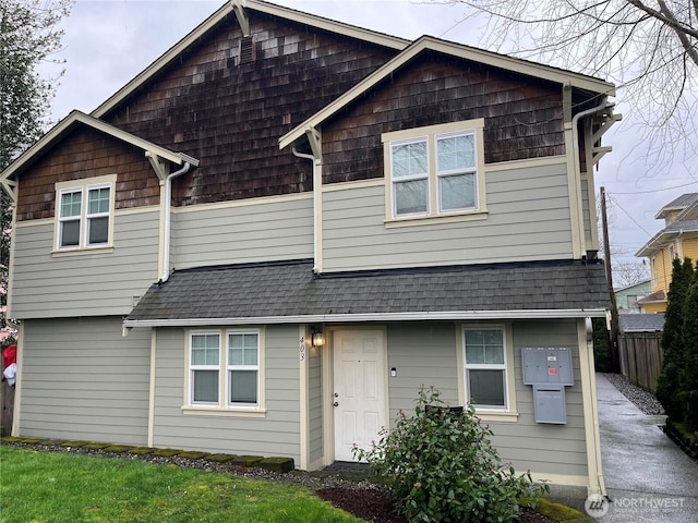 view of front of house with roof with shingles