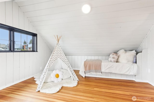 bedroom featuring vaulted ceiling and wood finished floors