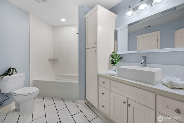 full bath featuring vanity, visible vents, bathing tub / shower combination, tile patterned floors, and toilet