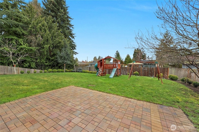 view of patio / terrace featuring a fenced backyard and a playground