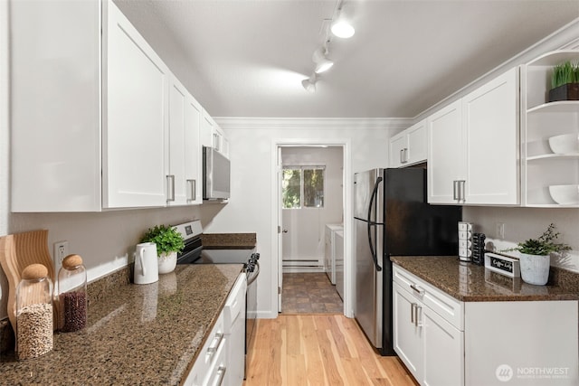 kitchen with open shelves, light wood-style flooring, white cabinets, appliances with stainless steel finishes, and washing machine and dryer