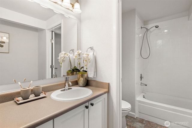 full bathroom featuring shower / washtub combination, toilet, and vanity