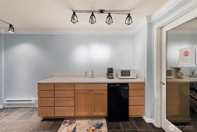 kitchen with ornamental molding, a sink, a baseboard heating unit, refrigerator, and white microwave