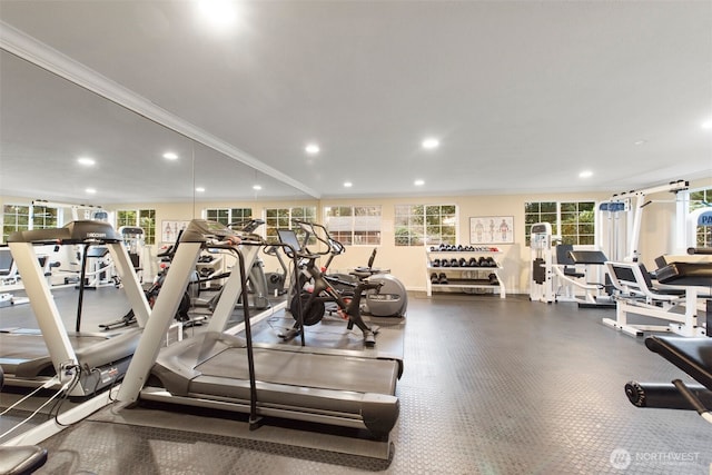 workout area featuring recessed lighting and ornamental molding