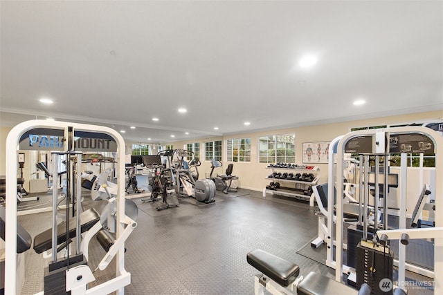 workout area featuring recessed lighting and ornamental molding