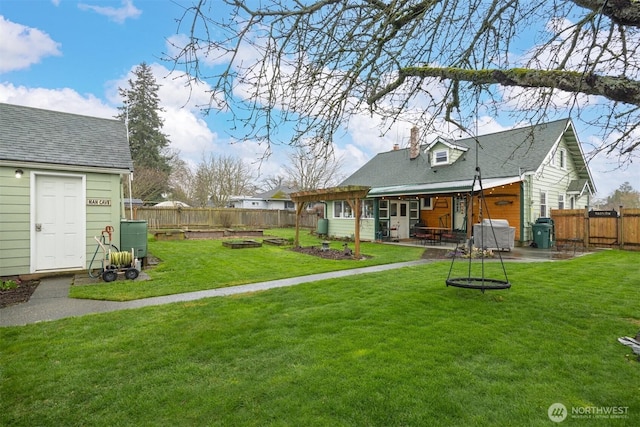 view of yard with a patio, a fenced backyard, and a fire pit