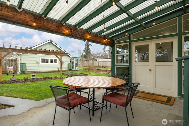 view of patio / terrace with outdoor dining area and fence