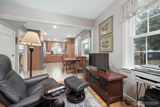 living area with light tile patterned floors and recessed lighting