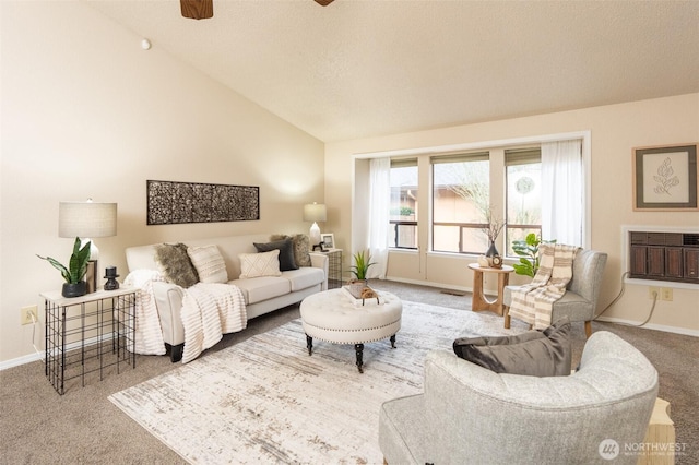 living area featuring baseboards, a wall mounted AC, lofted ceiling, and carpet floors