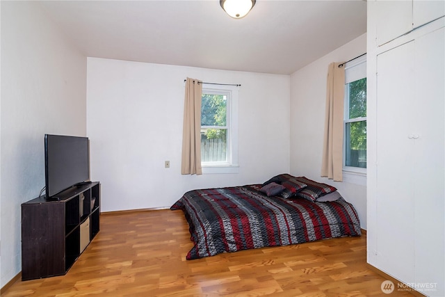 bedroom with light wood-type flooring