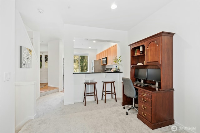 office area featuring recessed lighting, light colored carpet, and baseboards