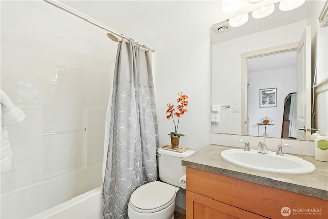 bathroom with toilet, vanity, and shower / tub combo with curtain