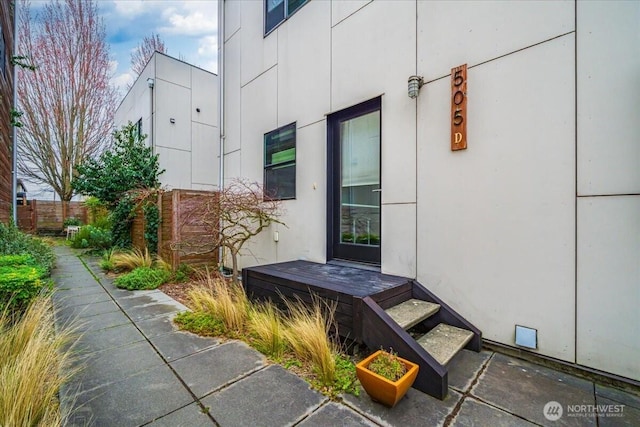 doorway to property with fence