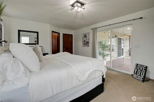 carpeted bedroom with access to exterior