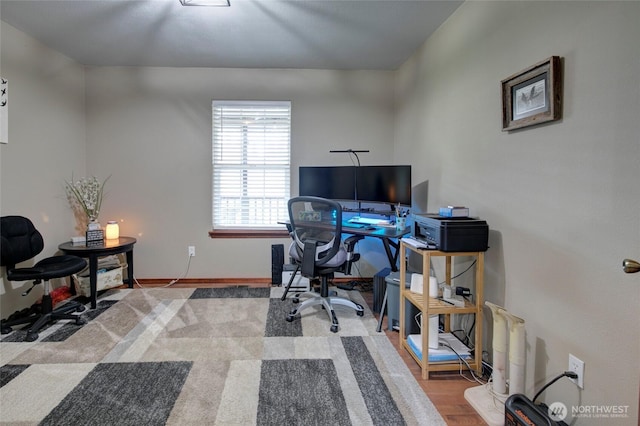 office with baseboards and wood finished floors