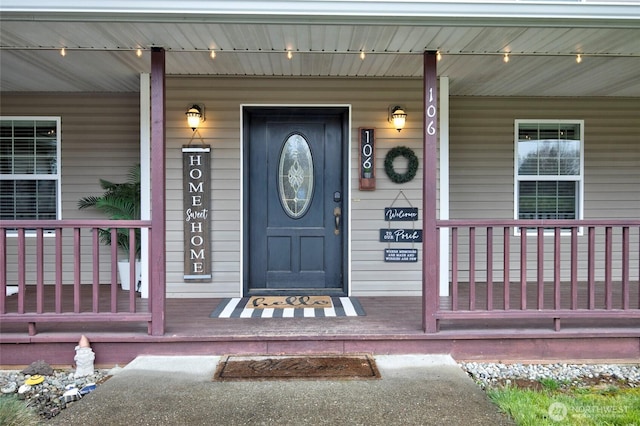 property entrance featuring covered porch