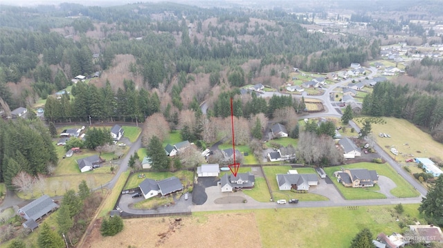 bird's eye view with a residential view and a view of trees