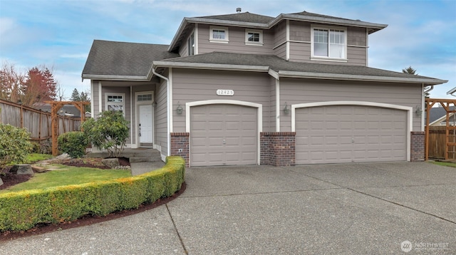 view of front facade with fence, driveway, a shingled roof, a garage, and brick siding