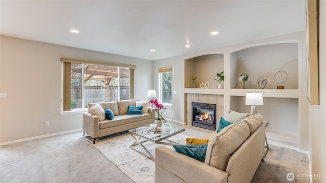 living area with carpet flooring, recessed lighting, a fireplace, and baseboards