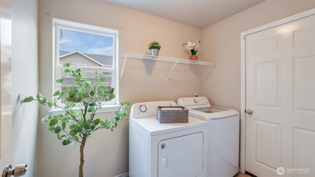 washroom featuring laundry area and independent washer and dryer