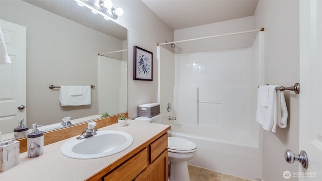 full bathroom featuring toilet, vanity, and bathtub / shower combination