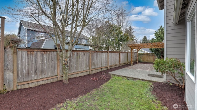 view of yard with a patio, a fenced backyard, and a pergola