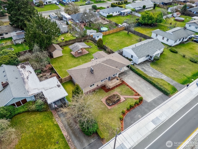 birds eye view of property with a residential view