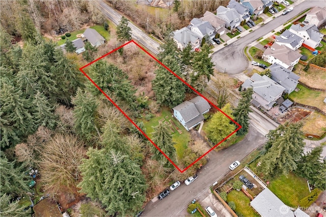 birds eye view of property with a residential view