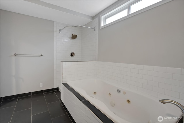 full bathroom with baseboards, a tub with jets, a tile shower, and tile patterned flooring