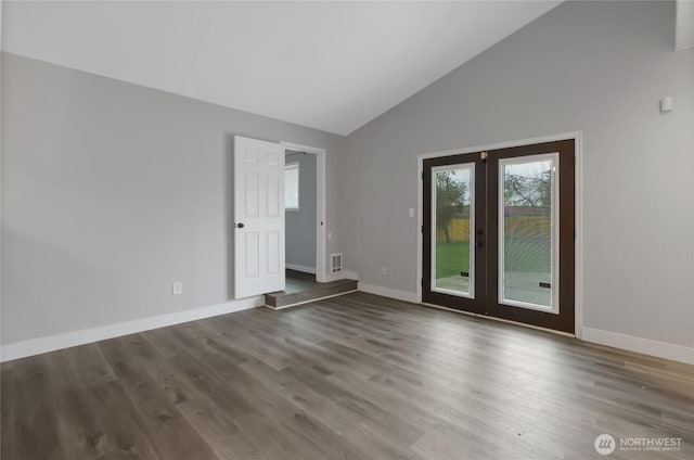 empty room featuring french doors, baseboards, and wood finished floors