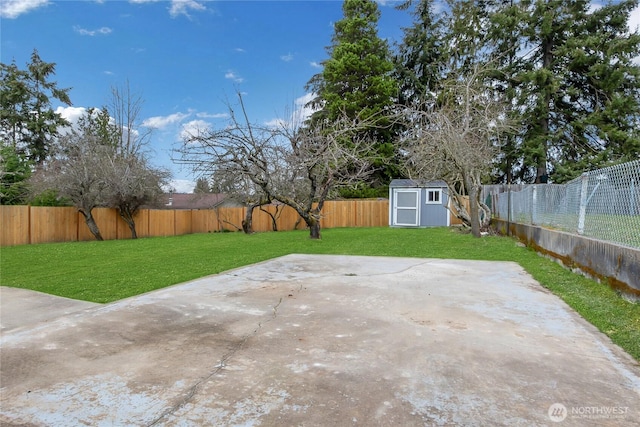 exterior space with a storage unit, an outbuilding, and a fenced backyard