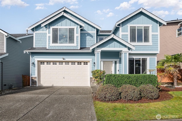 craftsman inspired home featuring concrete driveway, an attached garage, and board and batten siding