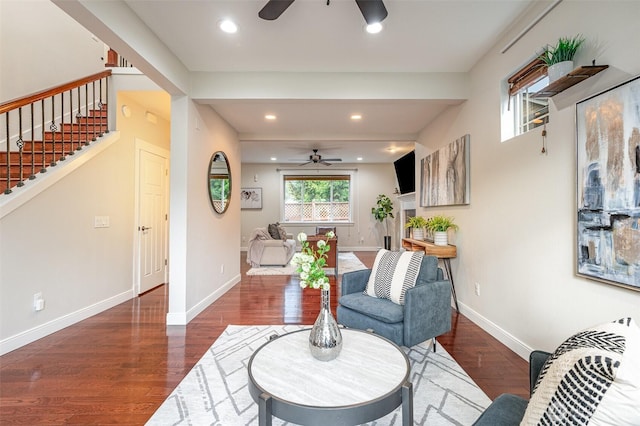 living room featuring recessed lighting, a ceiling fan, baseboards, and wood finished floors