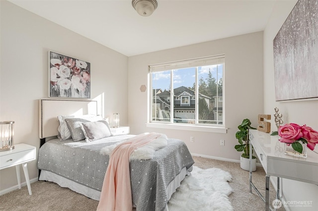 bedroom featuring carpet flooring and baseboards