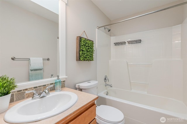 full bathroom featuring toilet, vanity, and  shower combination