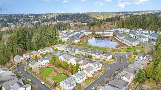 bird's eye view featuring a residential view and a water view