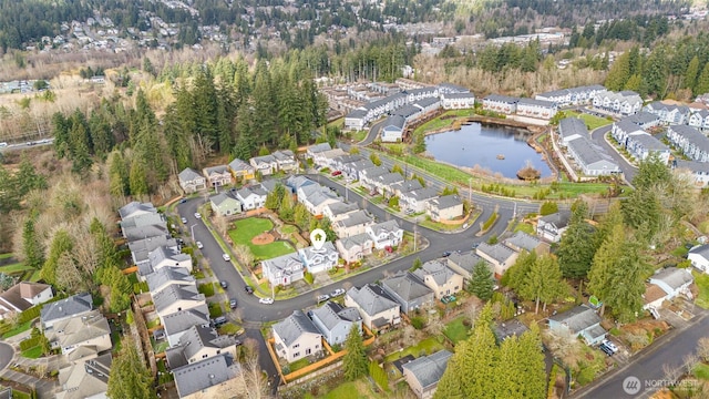 bird's eye view featuring a residential view and a water view