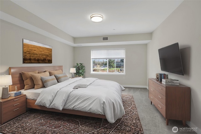 bedroom featuring visible vents, dark carpet, and baseboards