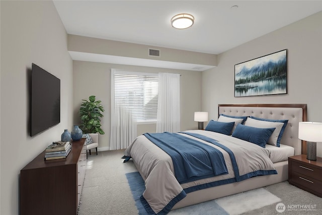 bedroom featuring visible vents and light carpet