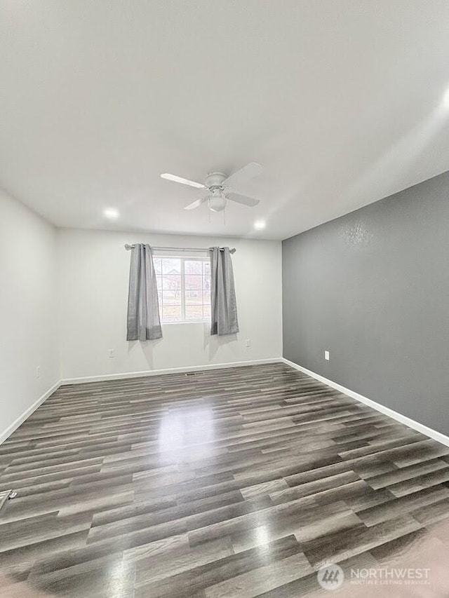 spare room with ceiling fan, baseboards, wood finished floors, and recessed lighting