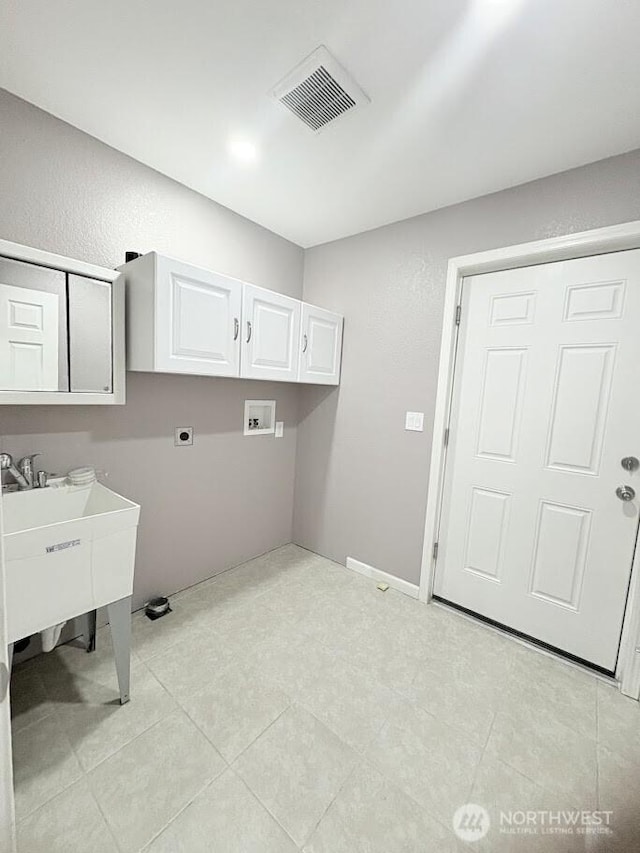 laundry area featuring hookup for a washing machine, cabinet space, visible vents, and hookup for an electric dryer