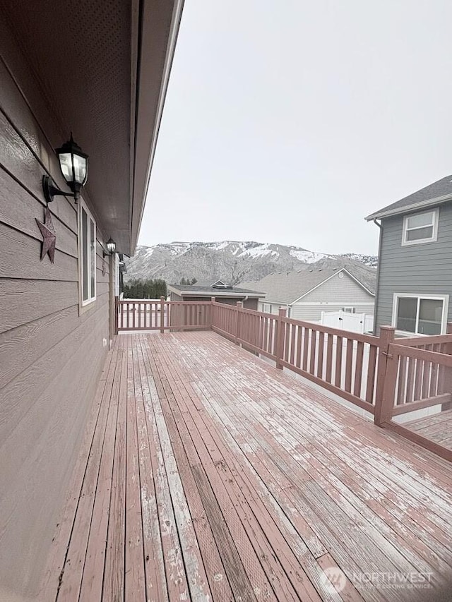 wooden deck featuring a mountain view