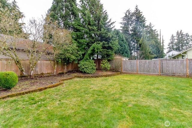 view of yard with a fenced backyard