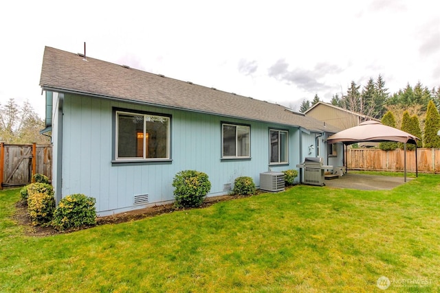 back of house with fence, central AC unit, a lawn, crawl space, and a patio